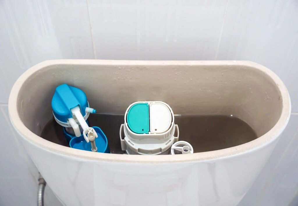 open toilet tank,repair toilet toilet tank that drains water, old toilet,Water valve mechanism.